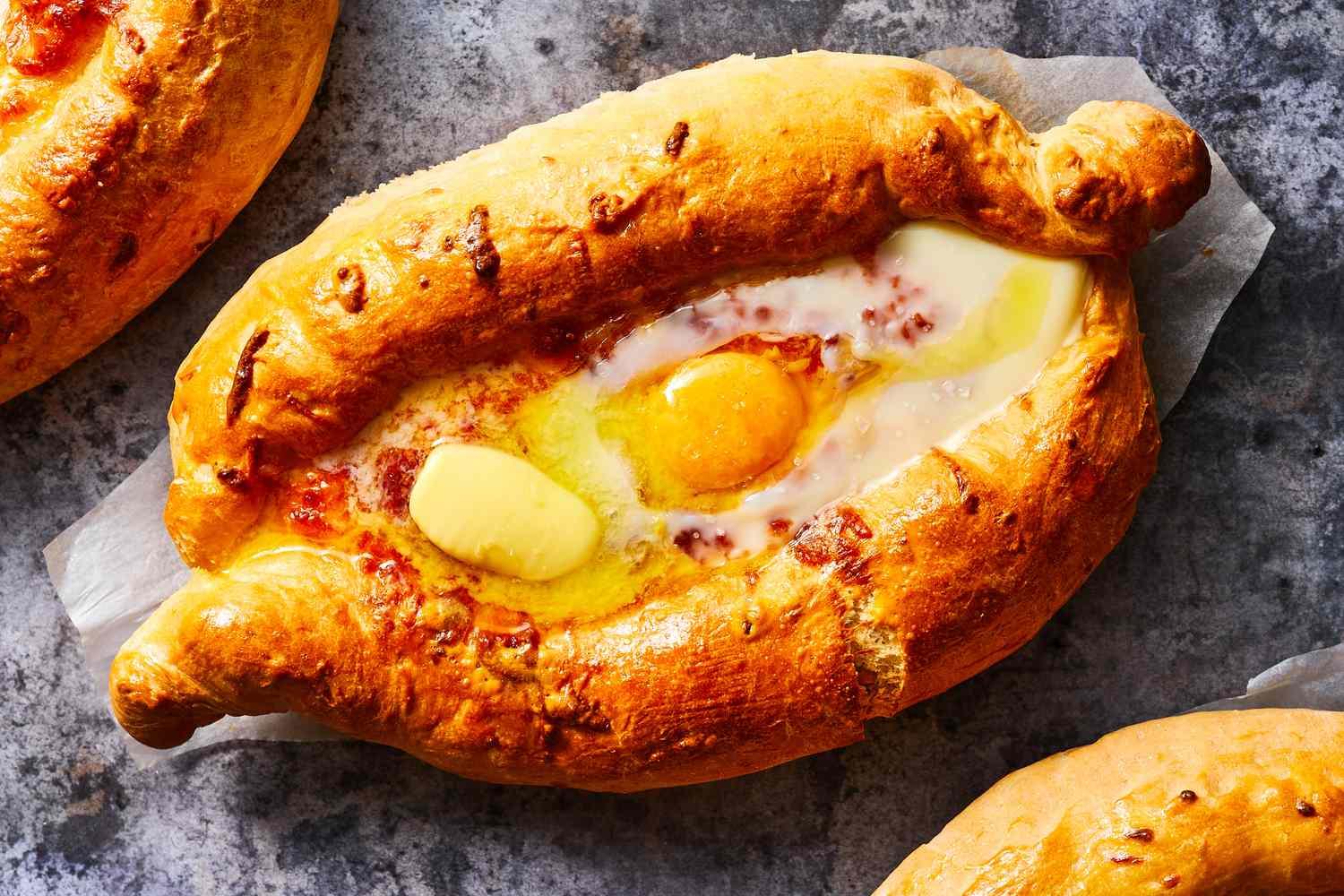 georgian cheese bread recipe acharuli khachapuri 1135515 hero 09 a6193fd9e2a94957aa3911e8bb7a605d